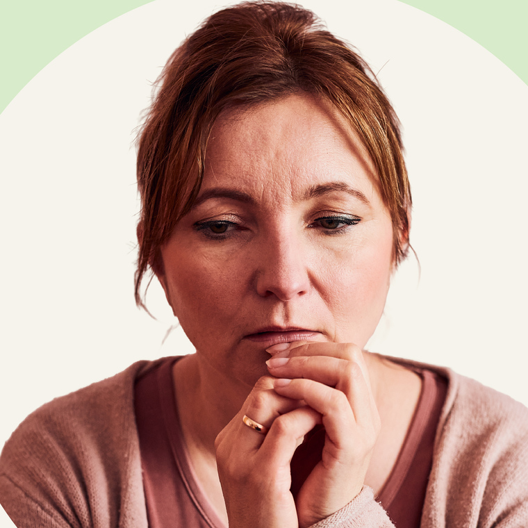 Woman in her 40s reflecting on the symptoms of perimenopause